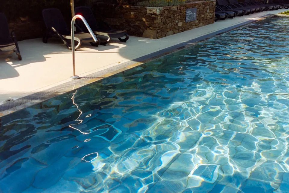 Sunlit pool with loungers in Provence