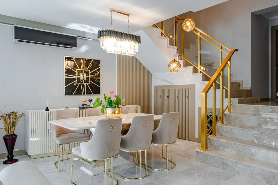 Dining room with a marble floor and staircase